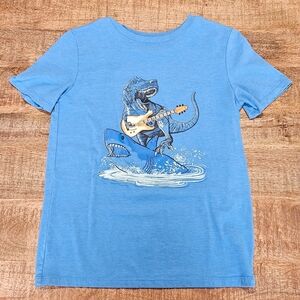 Boys Cat & Jack Dino Surfing on a Shark While Playing Guitar T-shirt size 12/14